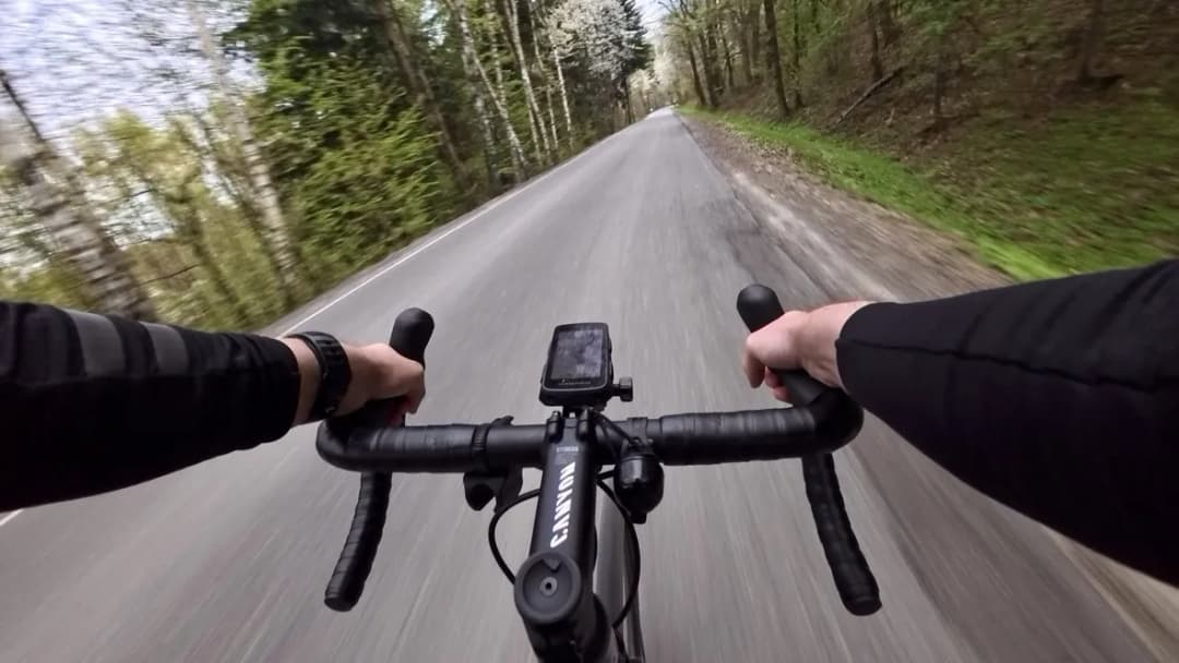 Photo showing Adam Noszczyński riding a bicycle